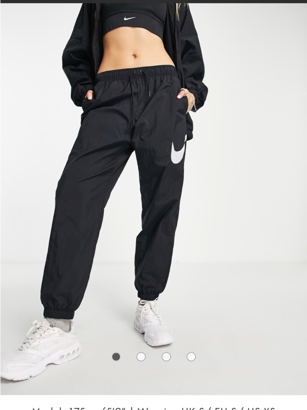 Nike Essential mid-rise woven cuffed pants in black sweatpants joggers